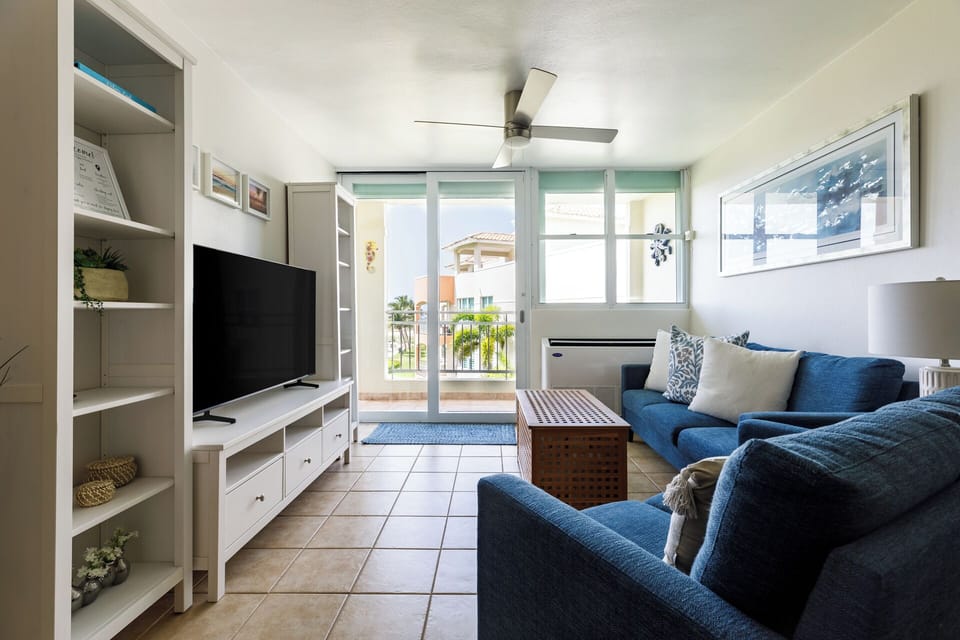 Comfortable and ample seating with a large TV and stunning ocean views.