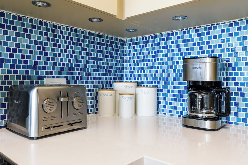 Wake up to complimentary coffee and tea, complete with creamer and sugar.