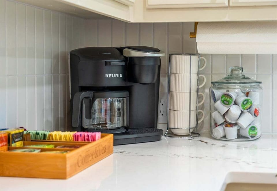 Start your day off right with a fresh cup of coffee from this cozy coffee nook, complete with a variety of options to fuel your adventures.