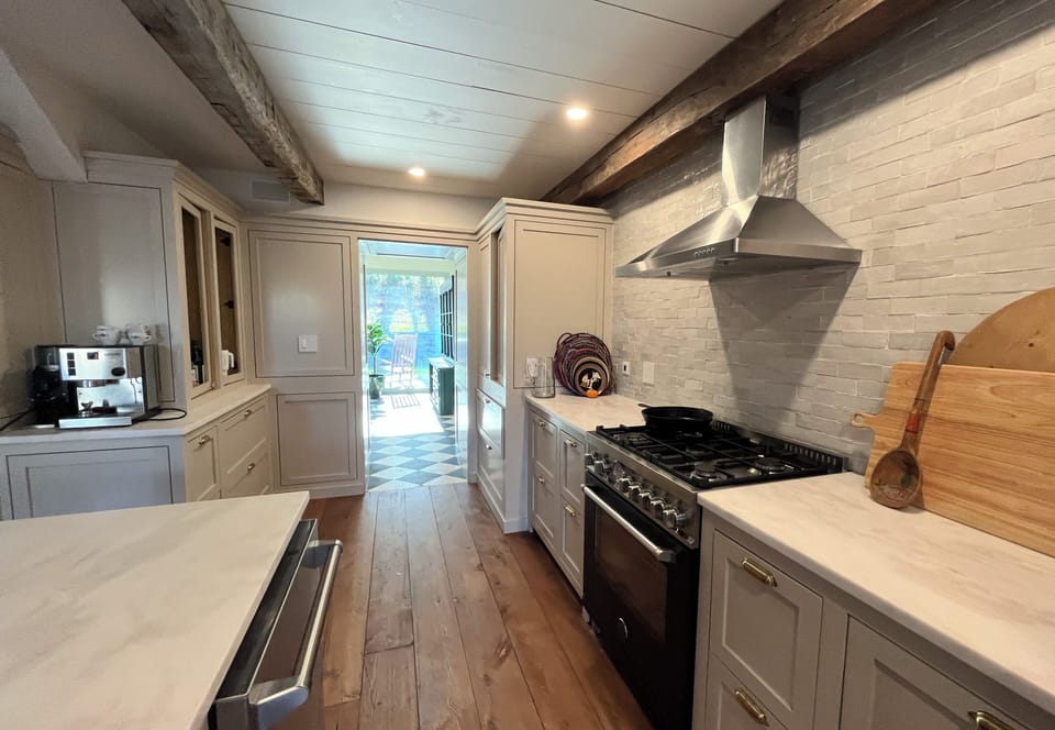 Kitchen with a walkway into the dining area / eat-in sunroom