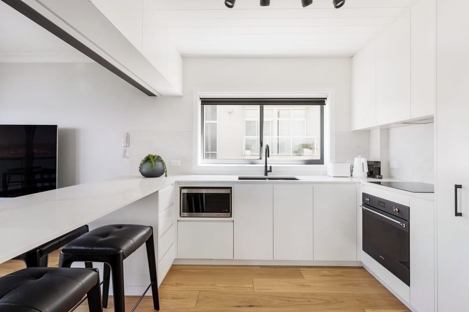 Designer kitchen with coffee machine,  microwave and dishwasher
