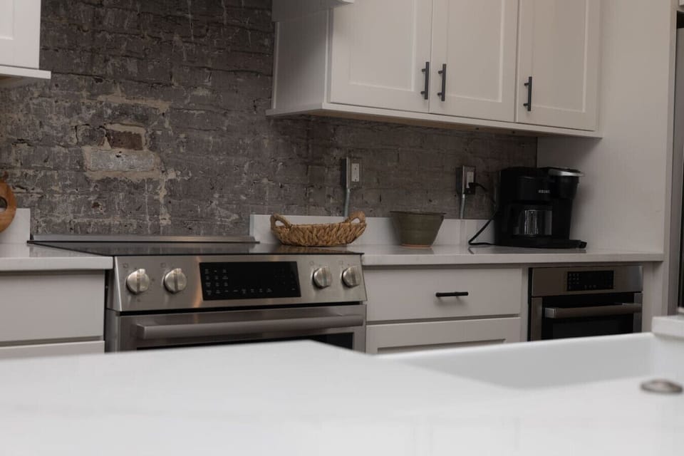 Kitchen Oasis: Enjoy cooking in this sleek kitchen with modern appliances and rustic charm!