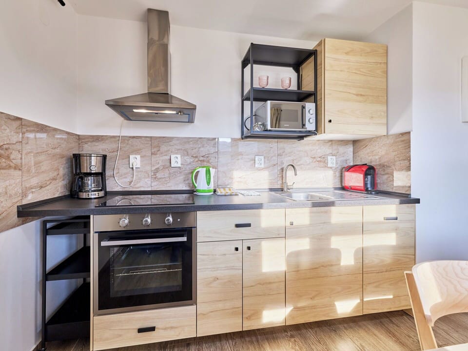 Furniture, Cabinetry, Interior Design, Wood, Flooring, Kitchen, Drawer, Countertop, Floor, Room