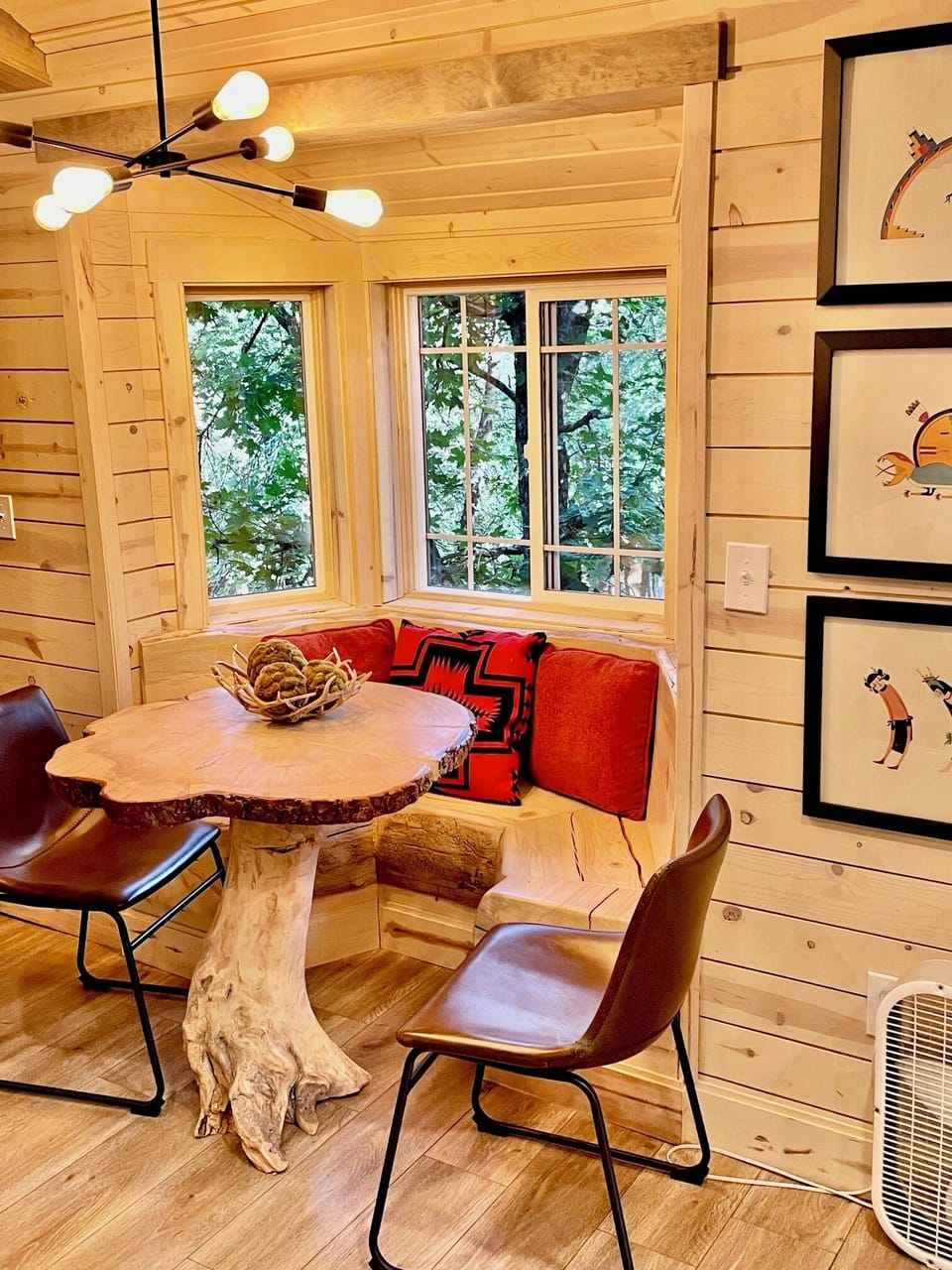 Sunny hewn log breakfast nook in the Carriage House