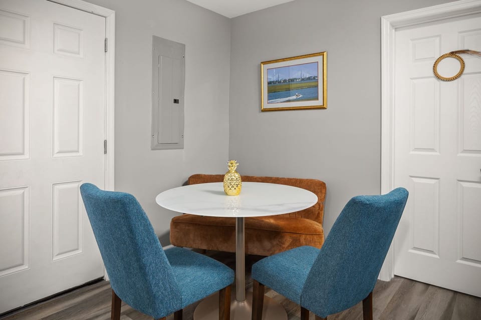 Cozy dining area with stylish furniture, perfect for enjoying meals.