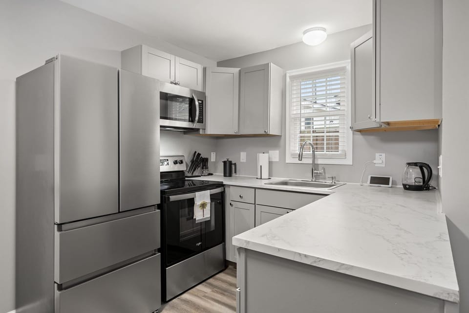 Ready to cook! Modern kitchen with stainless appliances and spacious.
