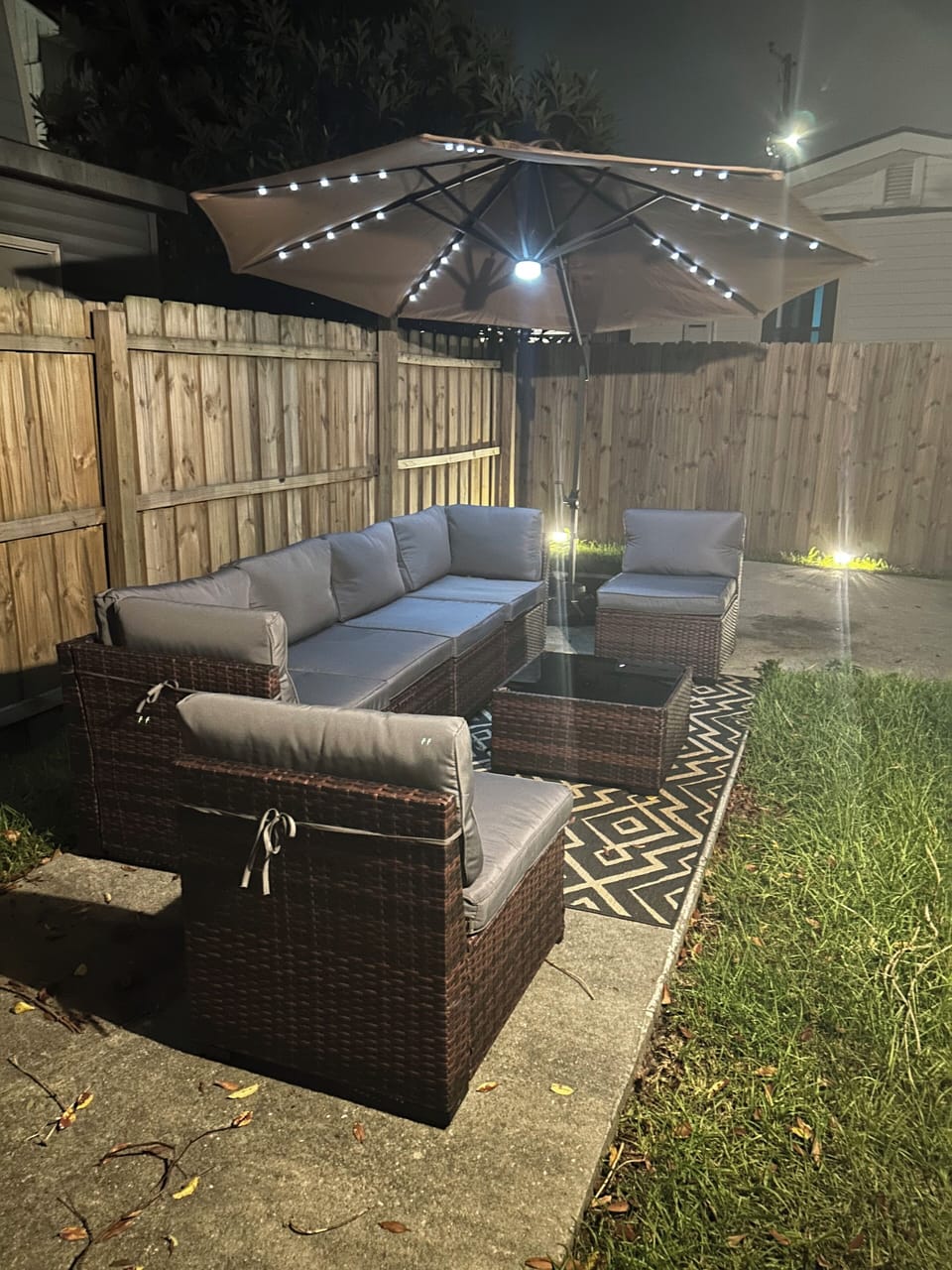 Cozy outdoor area with string lights warm and inviting atmosphere.