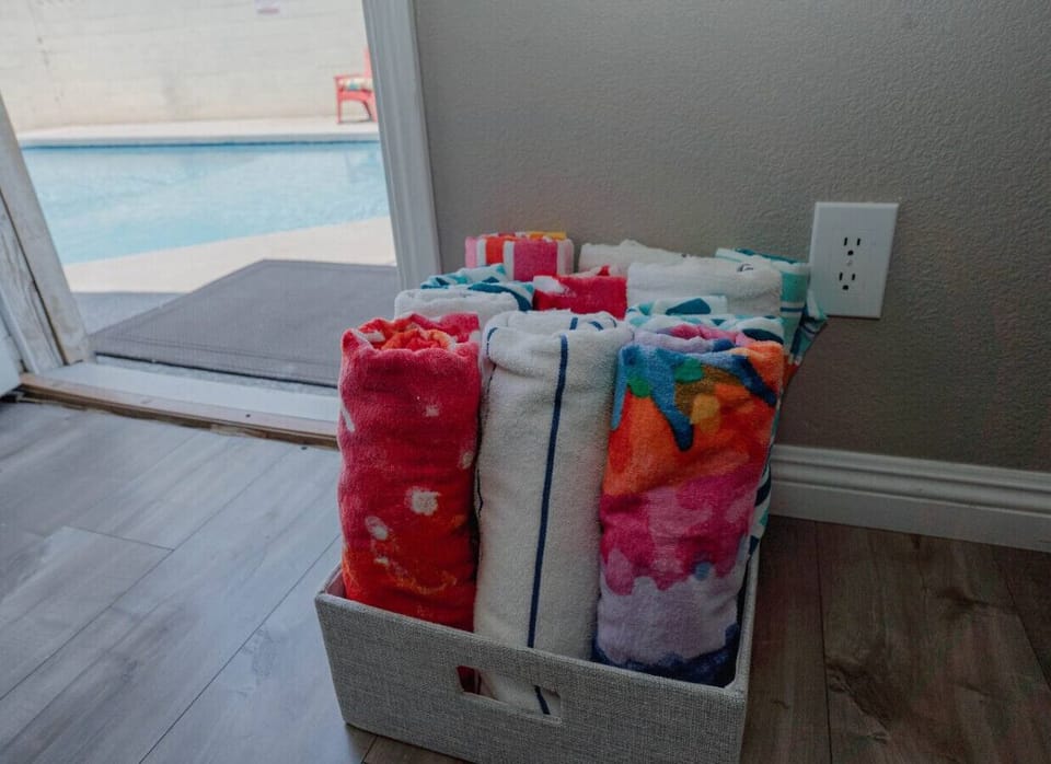 Enjoy the vibrant touch of our 12 colorful pool towels at your disposal.