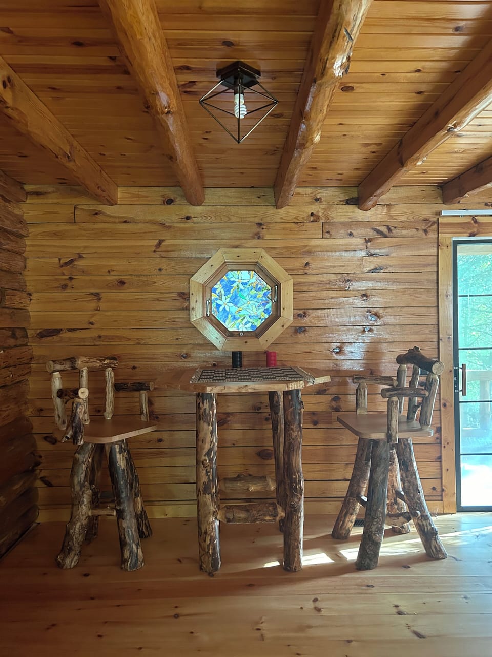 Pub Table with checkers and stained glass window in Master Bedroom