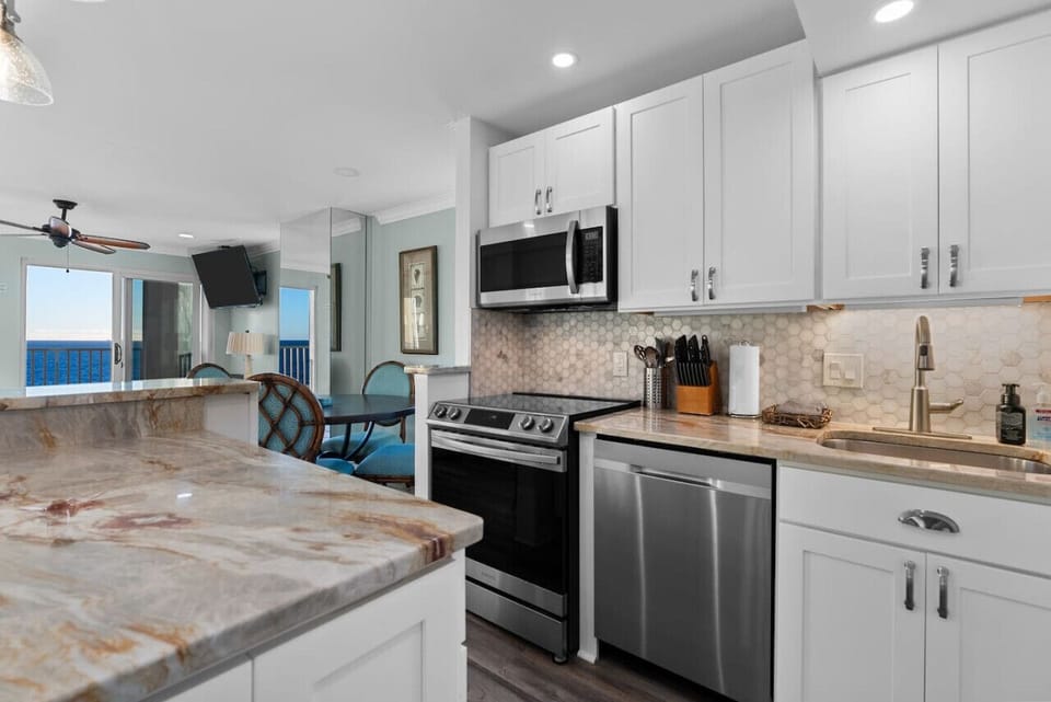 Sleek countertops, modern appliances, and everything you need to dine in style. _