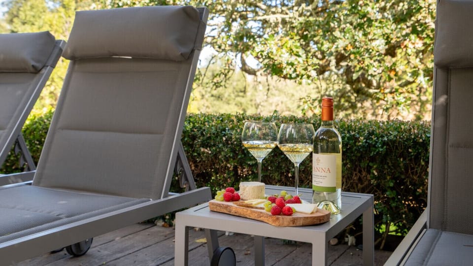 Have the pleasure of relaxing by the pool on one of the lounge chairs while sipping local wine.