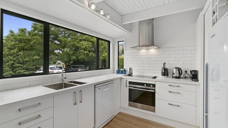 Modern kitchen with sleek cabinetry and quality appliances