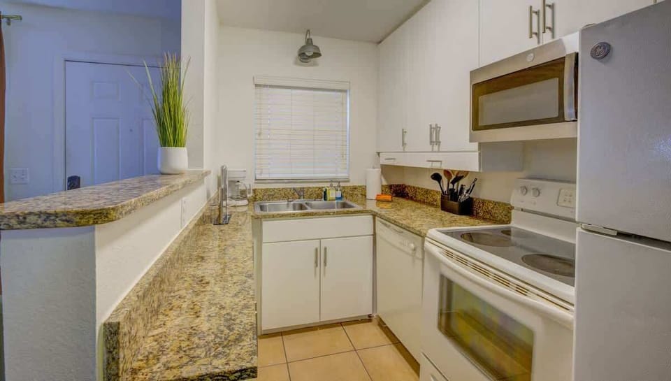 Start your day with ease in this bright and modern kitchen.