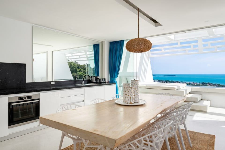 Indoor dining area opening onto the ocean-view terrace at Villa Ocean Serenity, Koh Samui