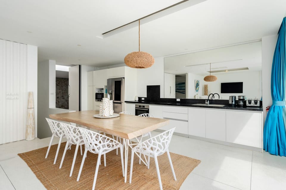 Fully equipped gourmet kitchen with modern appliances and rattan pendant light, Koh Samui luxury villa