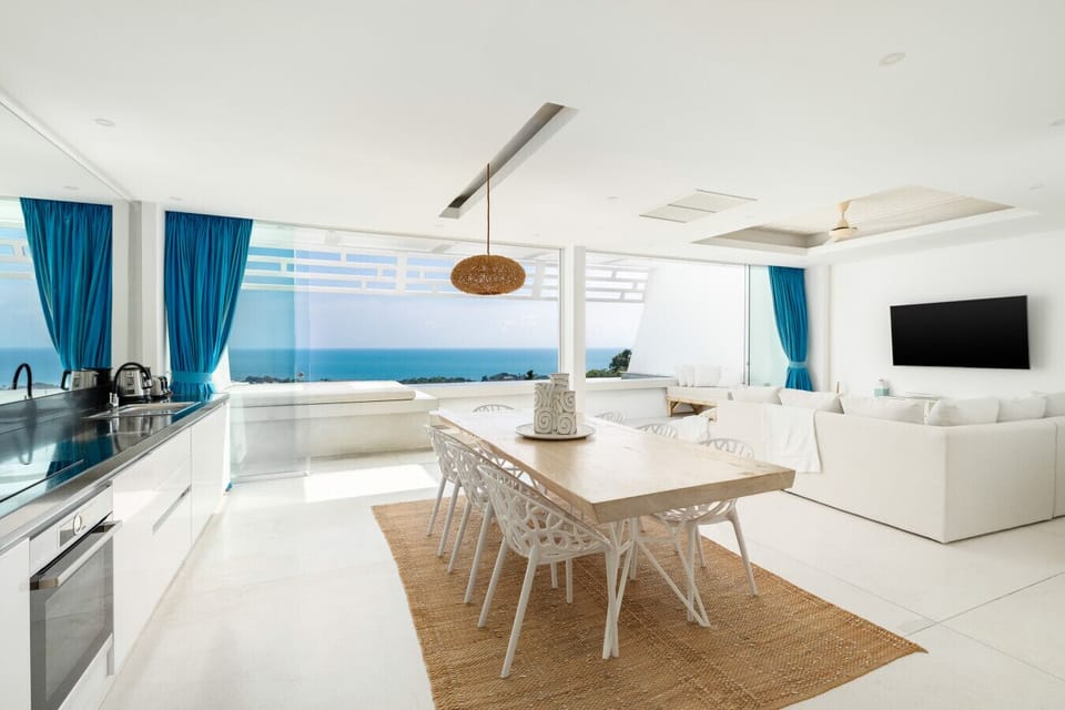 Coastal-style living room with natural textures and sea views in private Koh Samui vacation villa