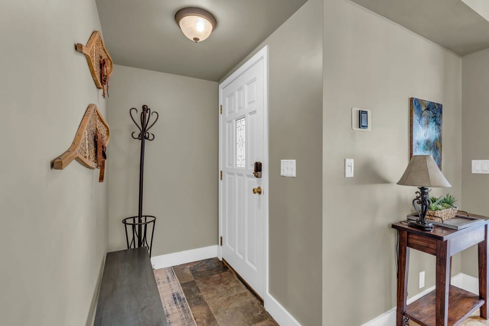 Entryway: Main level entryway, bench, coat rack