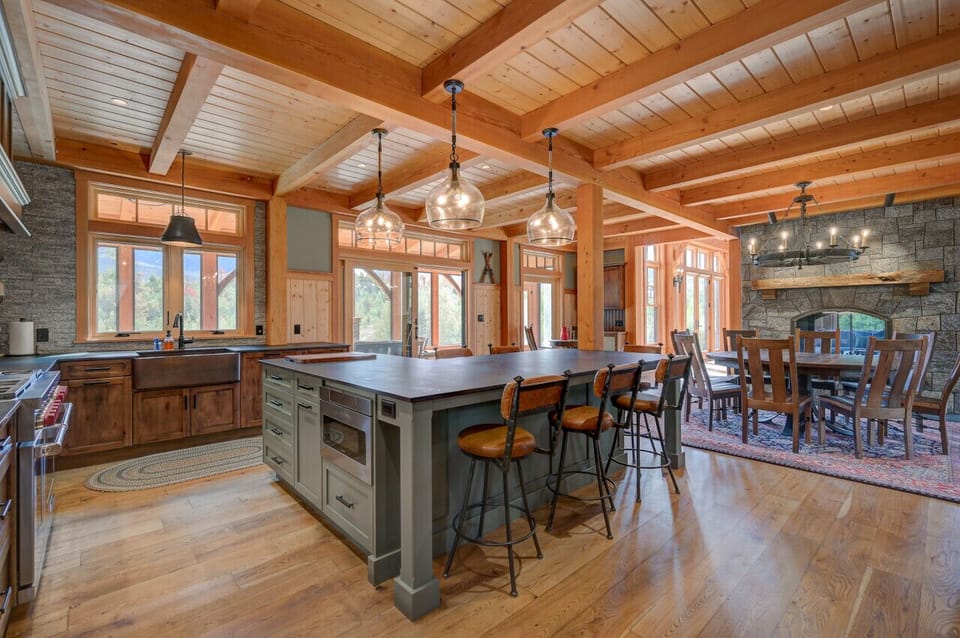 A chef’s gourmet kitchen with an open floor plan and high-end commercial appliances, perfect for cooking and entertaining.