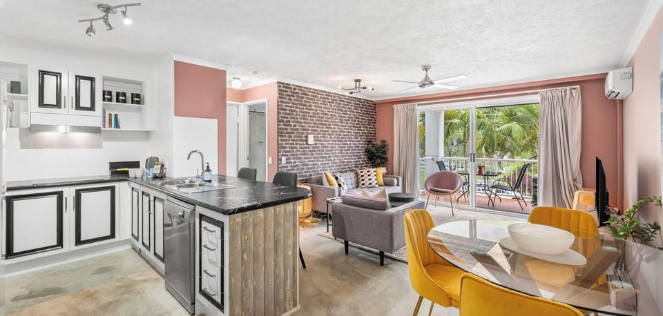 Open plan dining, living and entertainment area with ample space for entertaining inside and on the balcony