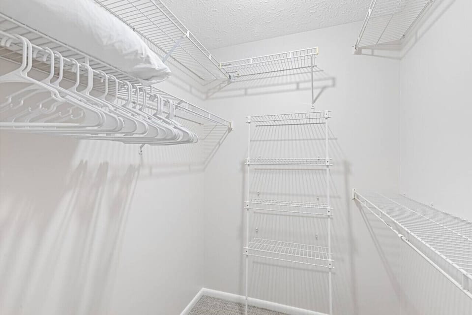 Primary Bedroom walk-in closet