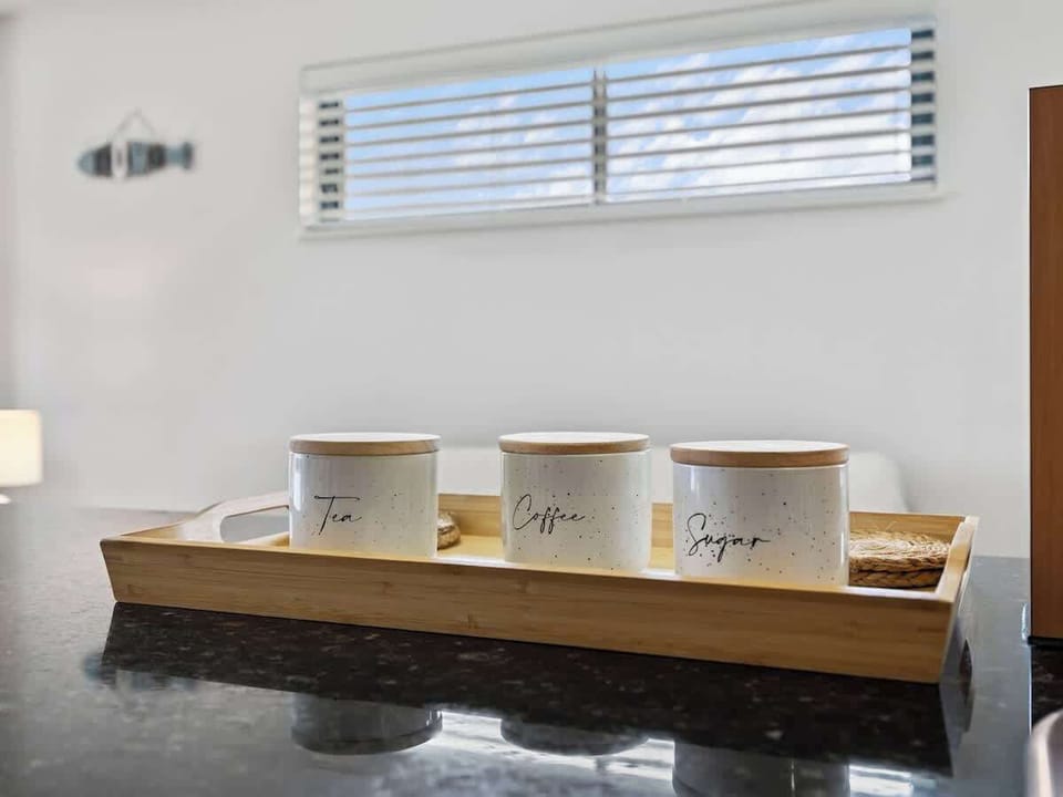 Start your day with a delightful cup of tea, coffee, and sugar in the fully-equipped kitchen. Enjoy the comforts of home with everything you need for a perfect morning.