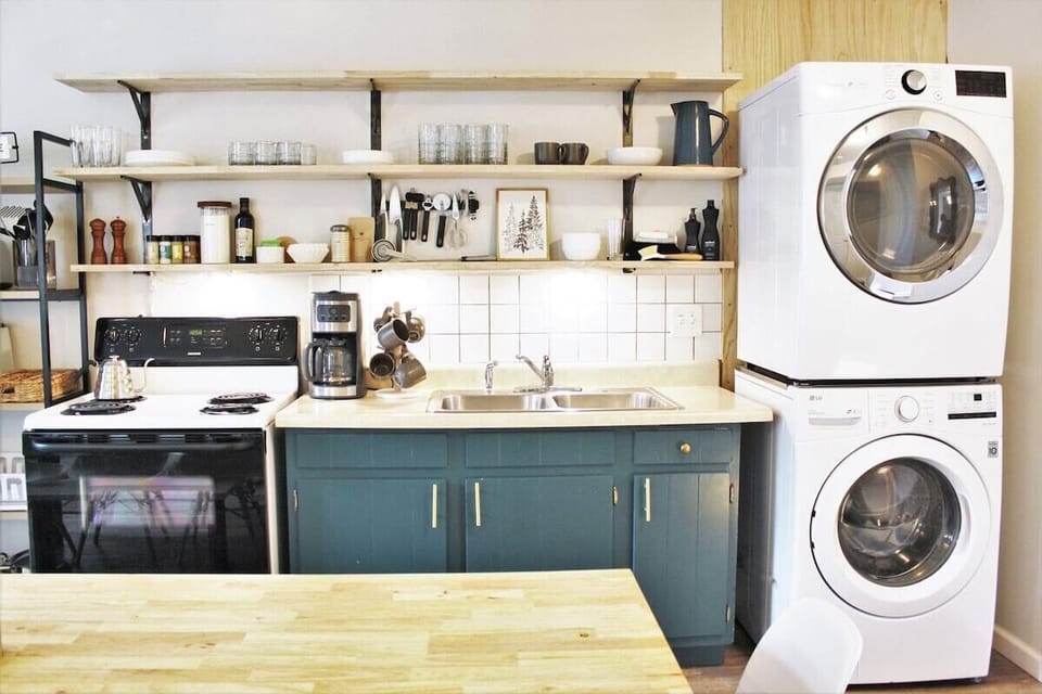 Whip up culinary delights in this stylish, fully-equipped kitchen with modern appliances!