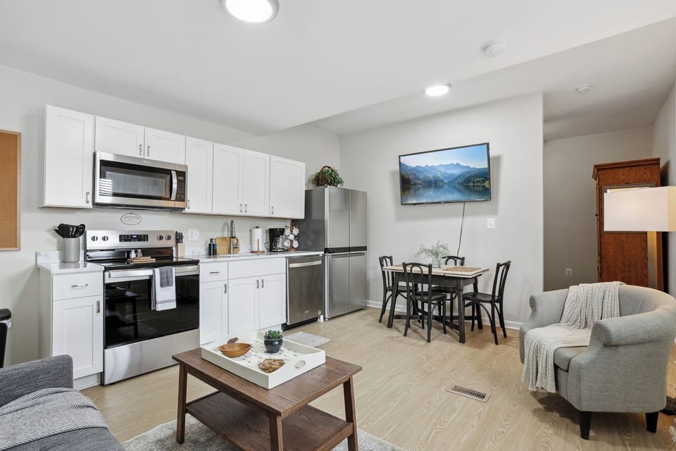 Modern kitchen with appliances, ideal for quick meals or casual dining.