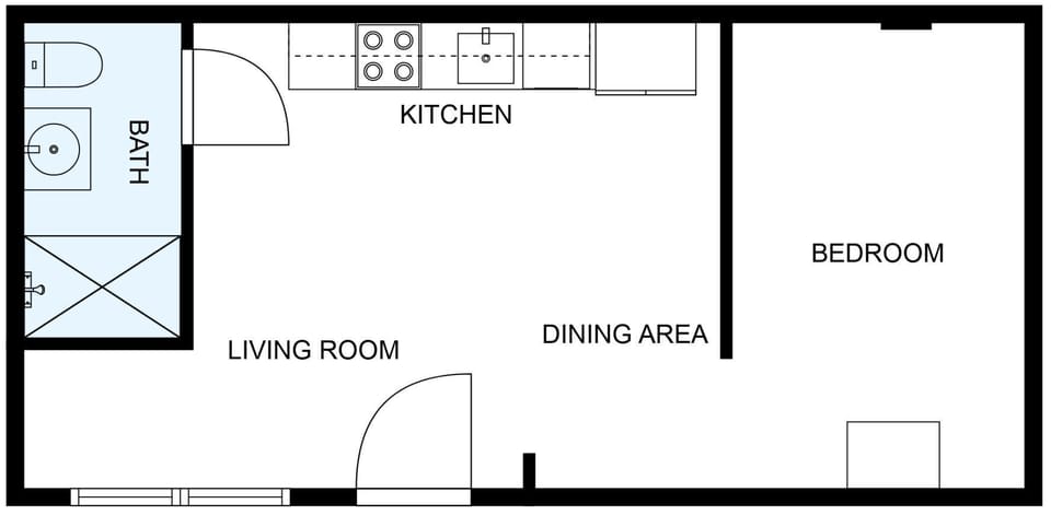 Open layout: living/kitchen area, separate bedroom, and compact bathroom.