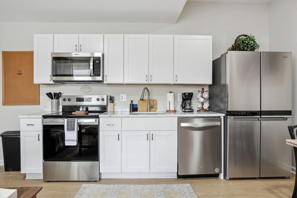 Modern kitchen with sleek appliances, perfect for cooking or dining in