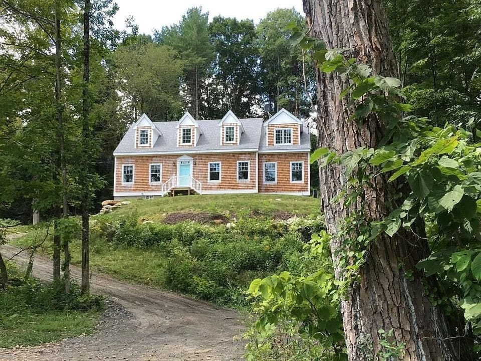 House is elevated and set back from Glendale Rd