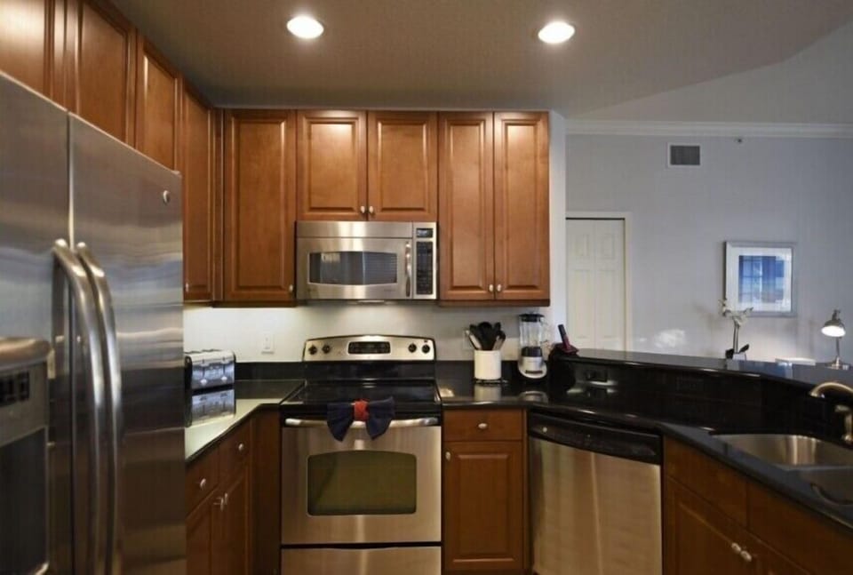 Modern kitchen with ample counter space and all the essentials for cooking.