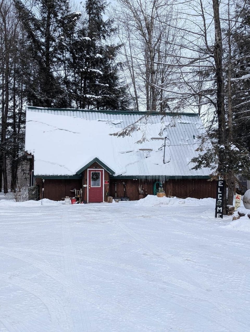 Front door of the cabin and parking area