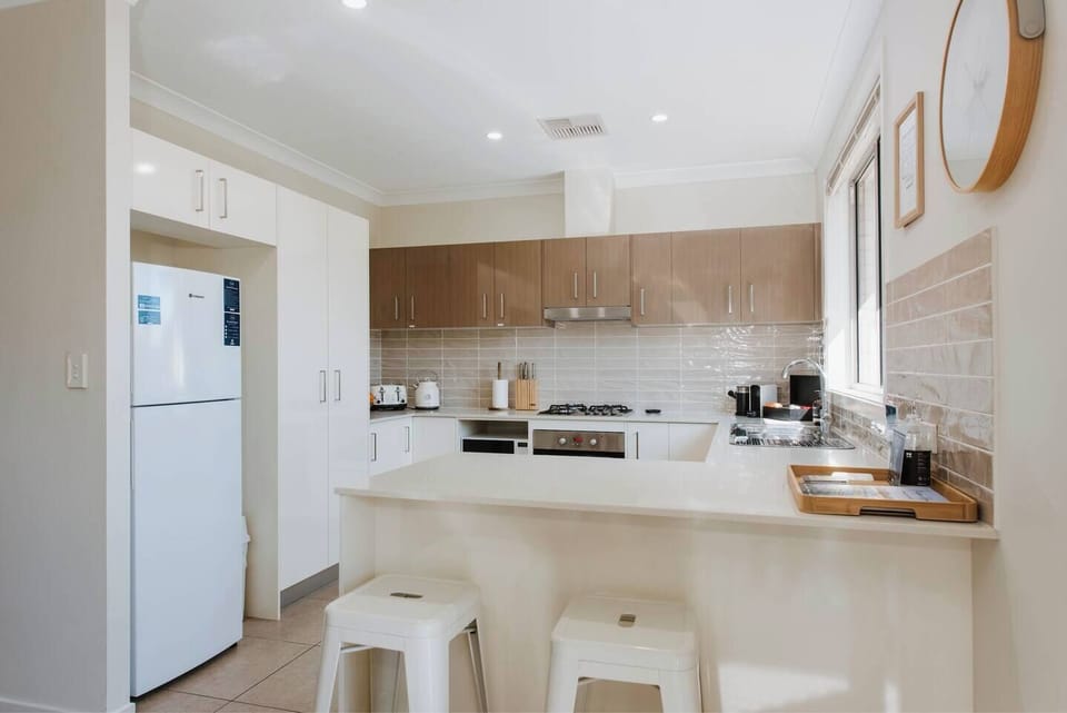  The modern, spacious kitchen makes it easy to whip up a feast and is designed around a breakfast bar.
