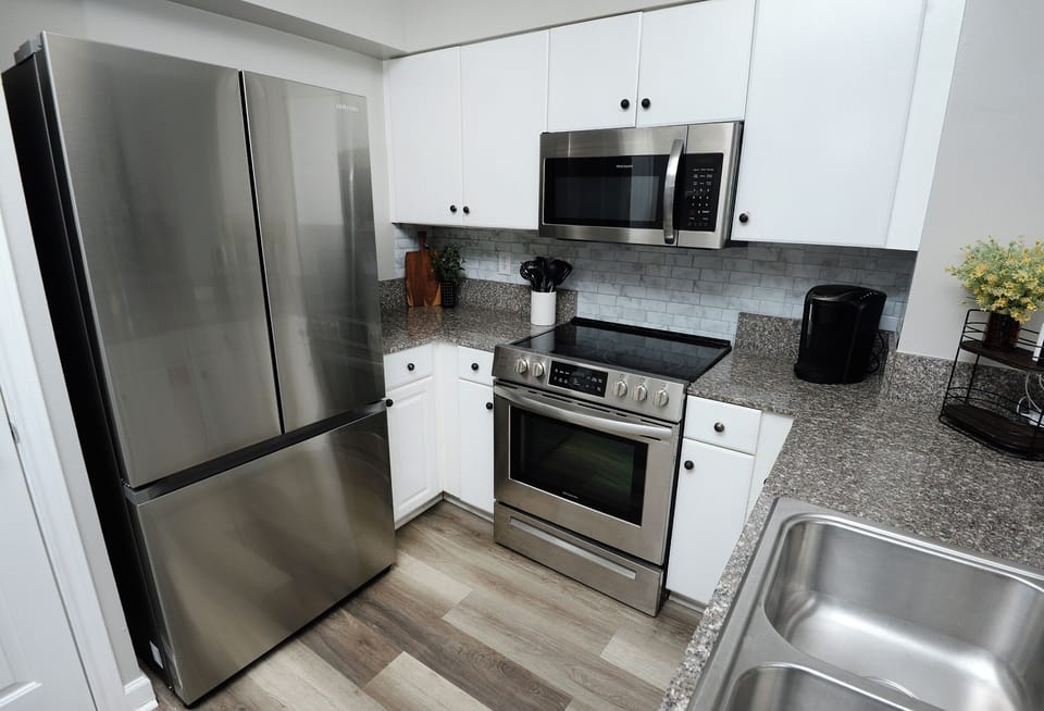 Full Stainless steel kitchen
Refrigerator 
Microwave
Stove
Dishwasher
Keurig