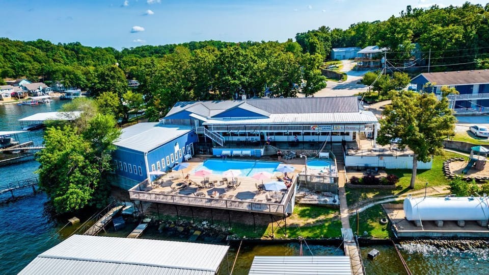 Aerial view of Alhonna Resort—docks, pool, and lakefront fun all in one spot!
