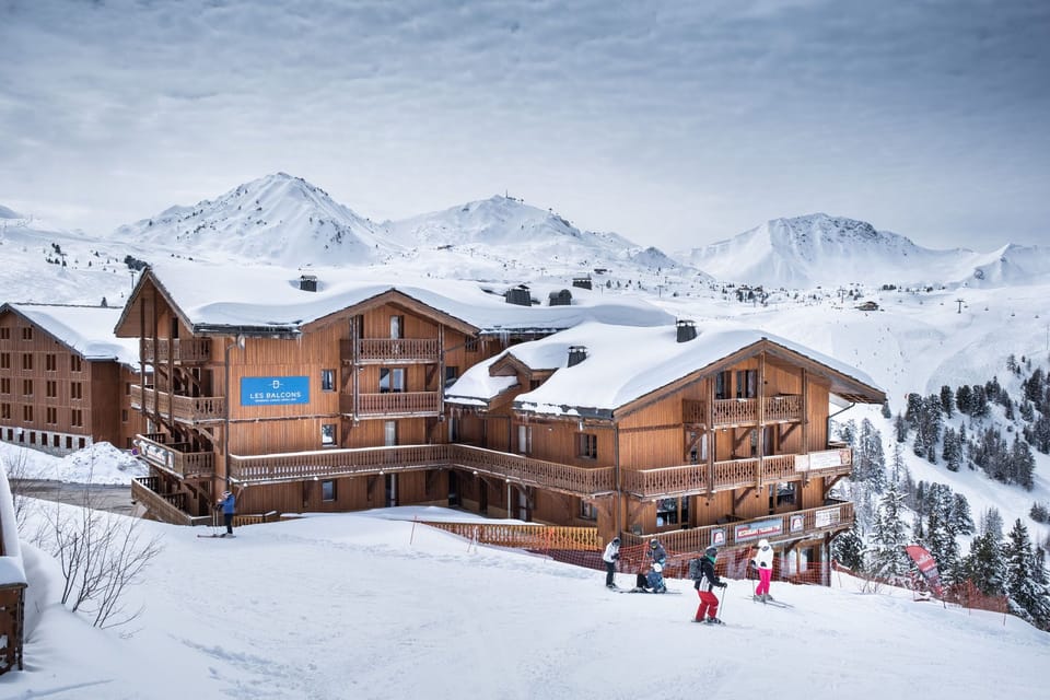 This alpine retreat offers direct access to the slopes and breathtaking views of snow-capped mountains.