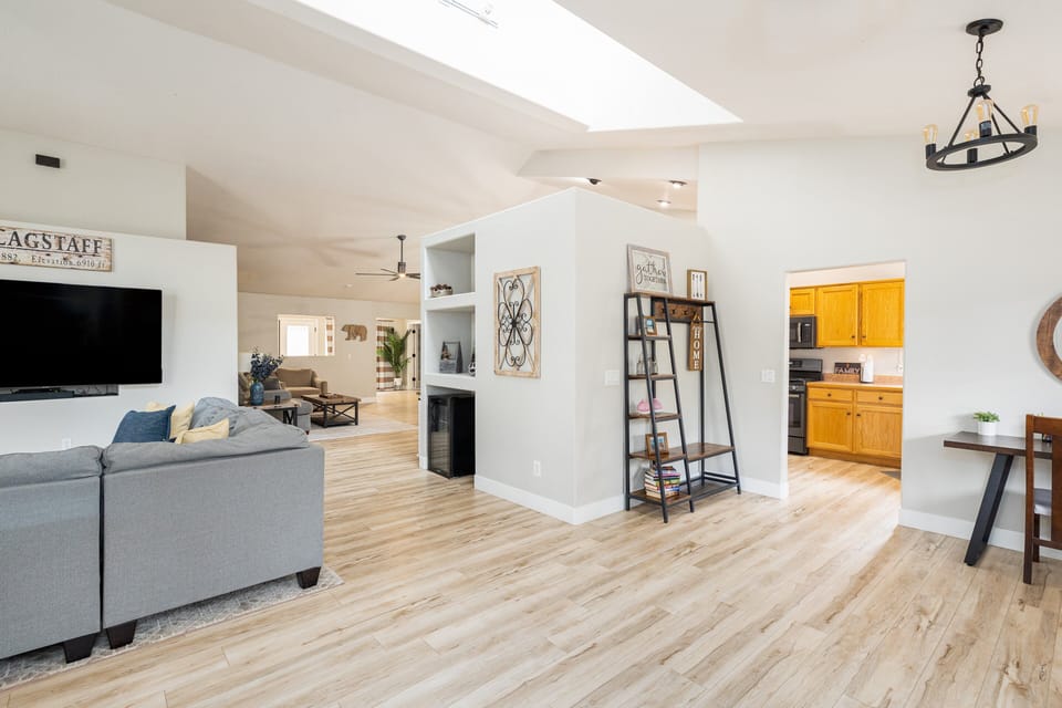 Open-concept layout with plush seating and a gas fireplace for a warm, inviting atmosphere.