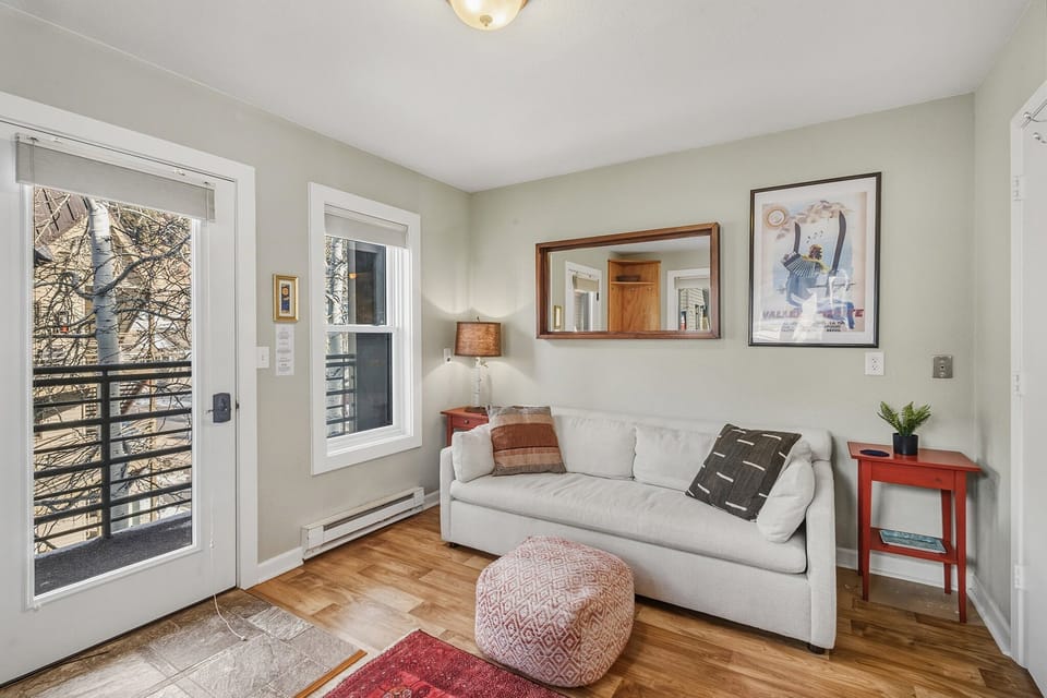 Third floor condo features private balcony, king bed, bunks as well as galley kitchen and cozy living space.