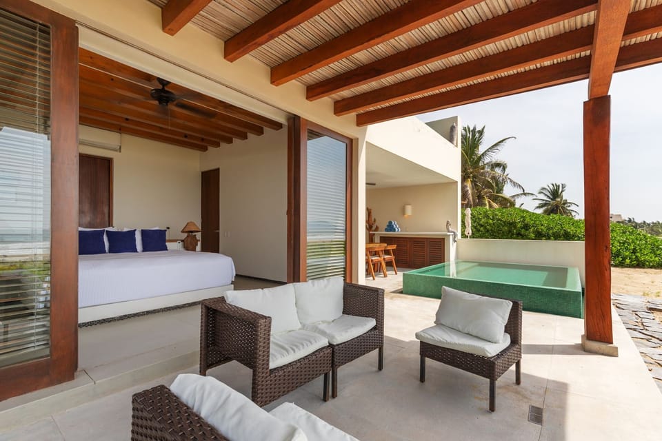 Enjoy seamless indoor-outdoor living with this private terrace, featuring cozy seating and a refreshing plunge pool.