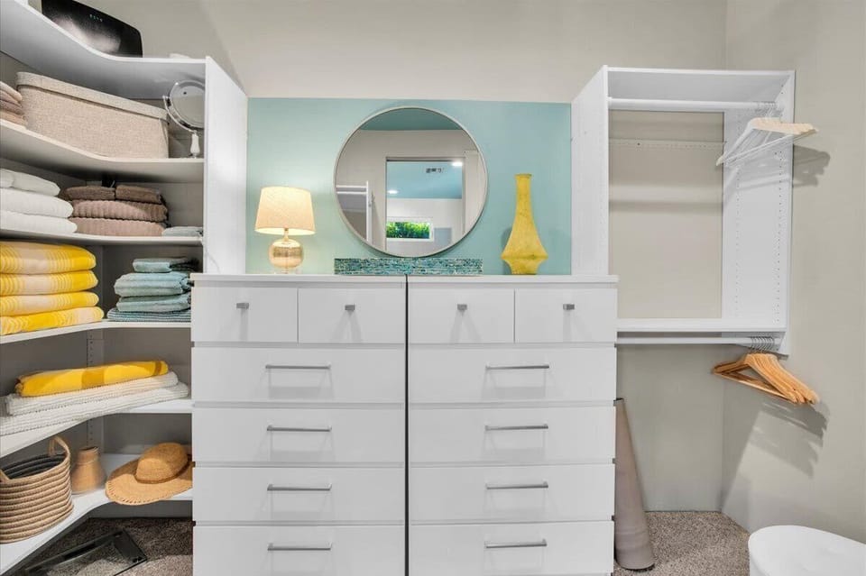 Experience luxury in our spacious ensuite primary king bedroom with walk-in closet! Enjoy direct access to the pool, creating a seamless indoor-outdoor flow. Relax in style, soak up the sun, and unwind in your private oasis. Perfect for your getaway!