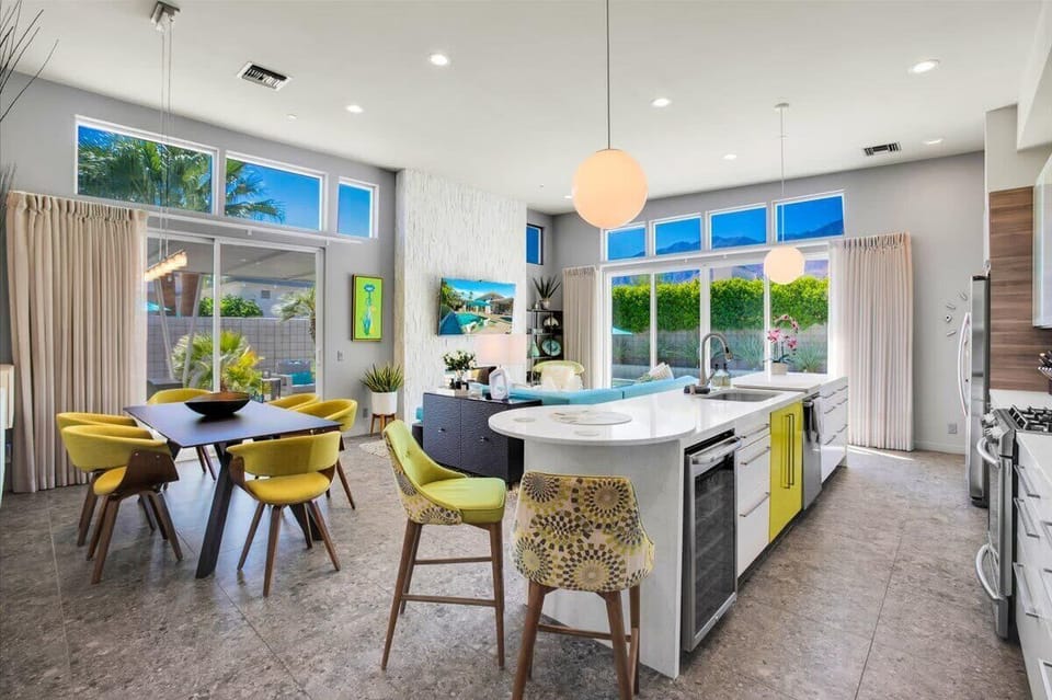 Step into the seamless elegance of our open living room, kitchen, and dining area—a harmonious blend of comfort & sophistication that invites you to experience true modern living & lifestyle where every corner is designed for relaxation & enjoyment.