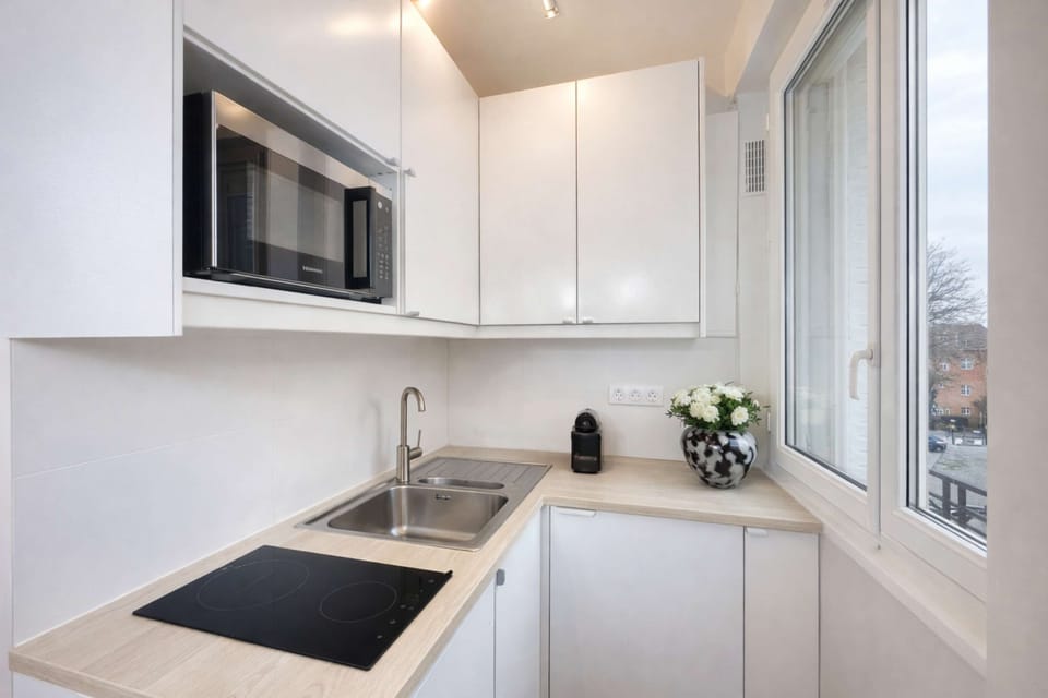 A kitchen ready with utensils and appliances to enhance your cooking experience.