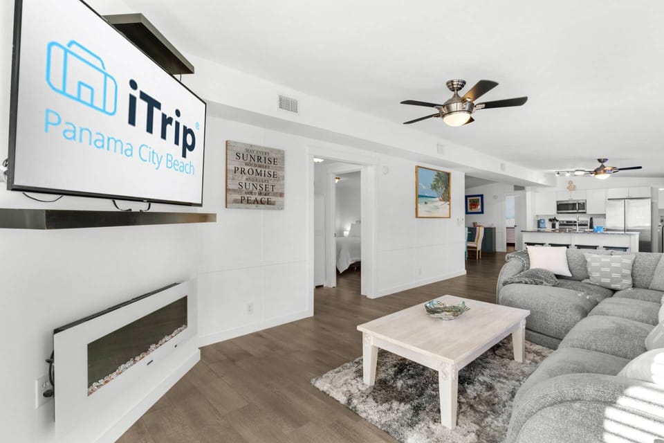 Cozy up on the oversized sectional and enjoy a movie by the fireplace