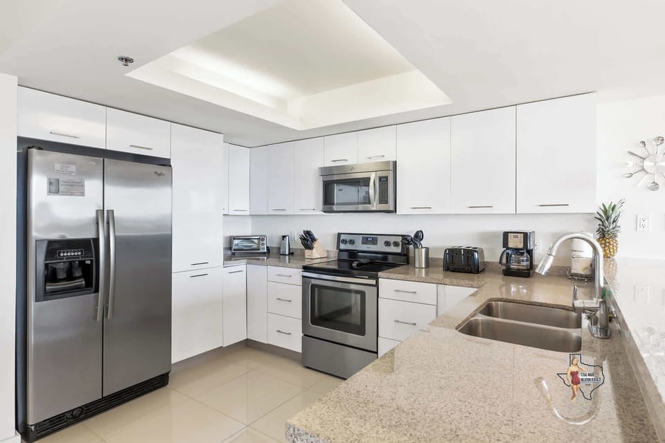 Sleek, modern kitchen with stainless steel appliances.