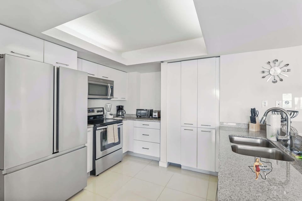 A sleek kitchen fully equipped with everything you need for cooking at home.