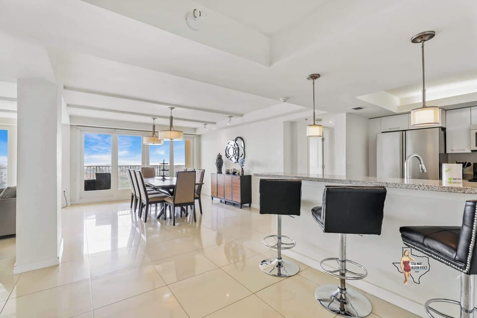 A modern kitchen with bar seating, perfect for casual dining or entertaining.