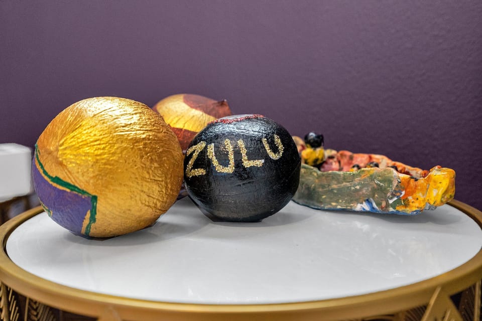 Celebrate the spirit of Mardi Gras with these iconic Zulu coconuts—a fun nod to New Orleans' vibrant traditions, adding local charm to your stay.