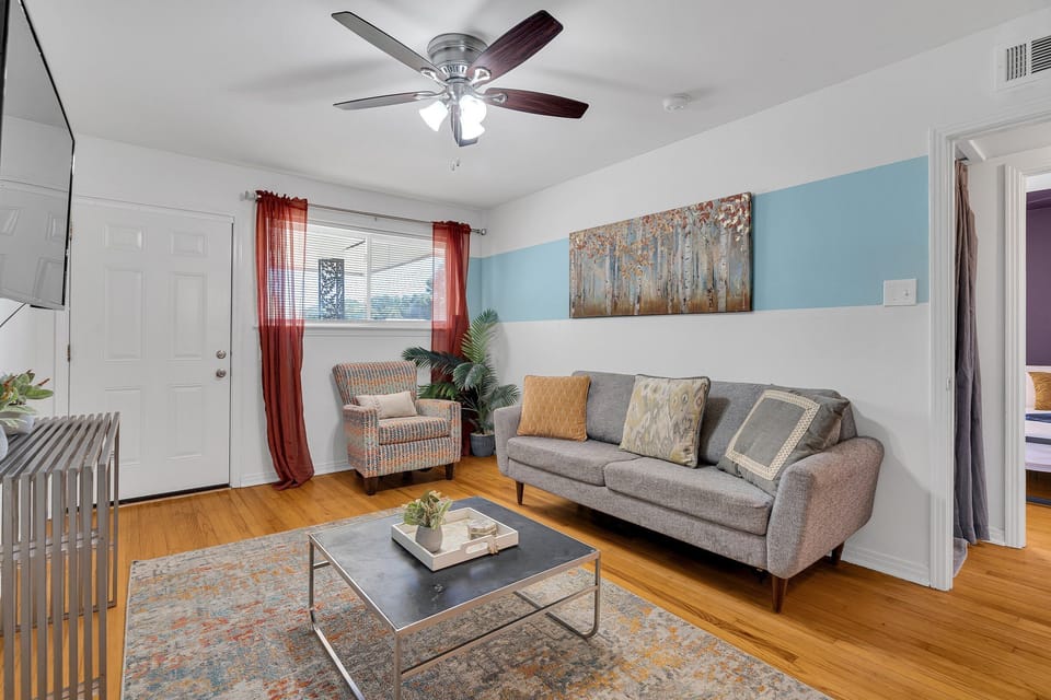 Open, airy, and inviting—this seamless living and dining area is perfect for gathering with loved ones or enjoying a quiet evening in after exploring the city's vibrant streets.
