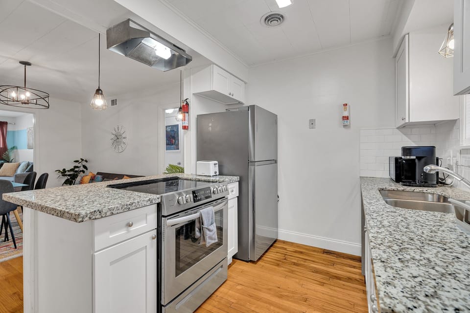 Start your day at the breakfast bar with a cup of coffee before heading out to explore! This kitchen’s bright and inviting design makes it a joy to use.