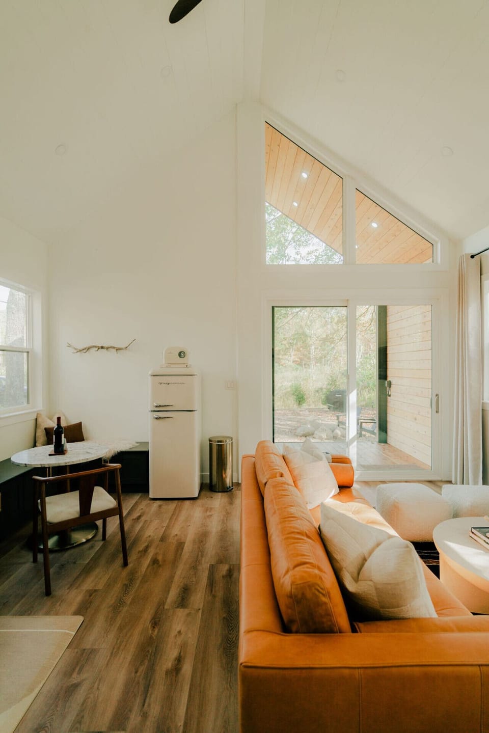The open concept living space makes this cozy tiny cabin feel large.